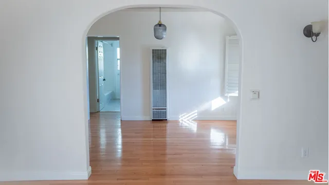 a view of a small house with potted plants