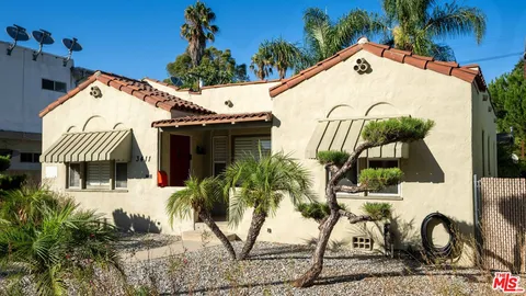 a view of empty room with windows and fireplace