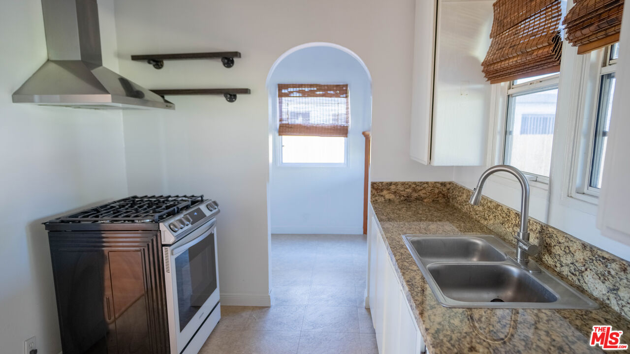 3411 Larga Avenue Los Angeles, CA 90039 - Photo 9 of 26 a kitchen with sink a stove and refrigerator
