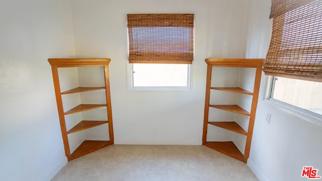a bathroom with a tub a sink and a window