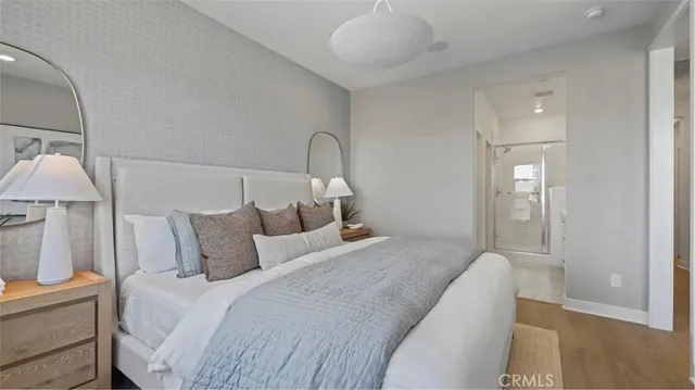 a bedroom with bed and a night stand