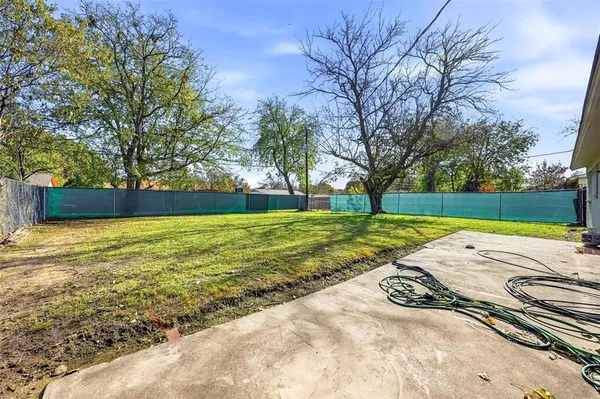 a view of yard with swimming pool and green space