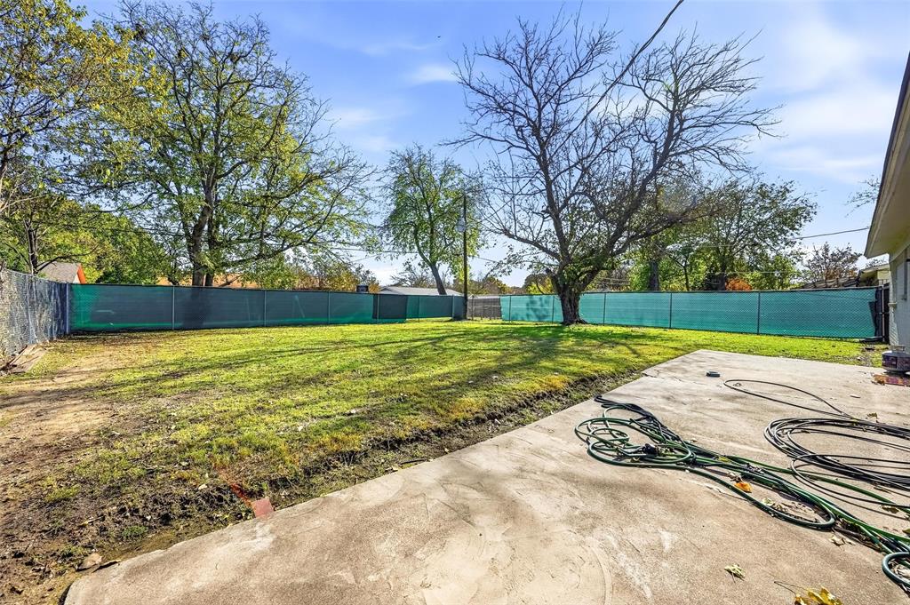 6524 Bernadine Street Watauga, TX 76148 - Photo 15 of 16 a view of yard with swimming pool and green space