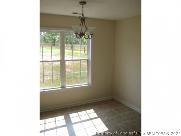 22 Rockingham Street Spring Lake, NC 28390 - Photo 5 of 20 a window in an empty room