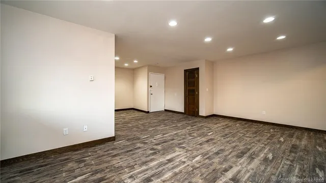 a view of a livingroom with wooden floor