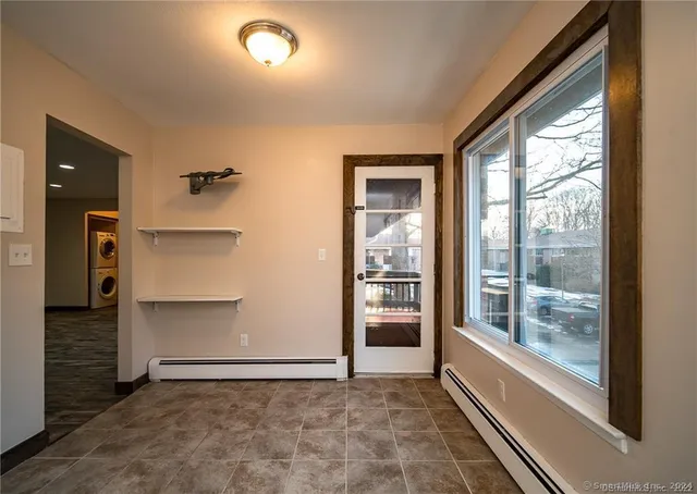 a view of an empty room and a window