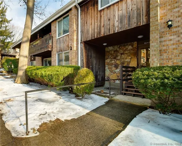 a view of a backyard with sitting area