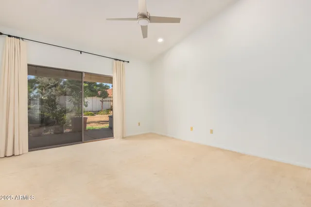 a view of an empty room with a glass door