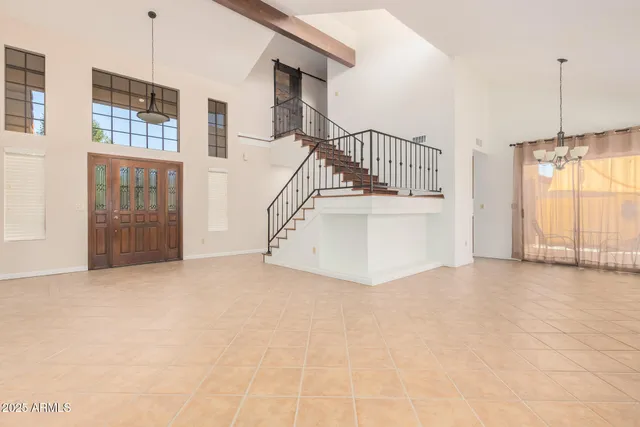 a view of a room with stairs and a window