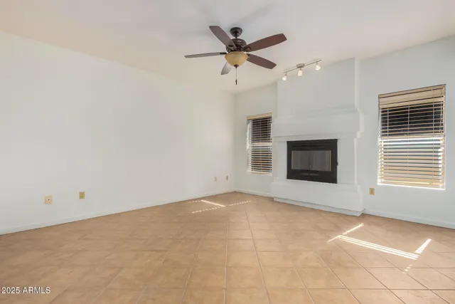 a view of an empty room with a fireplace