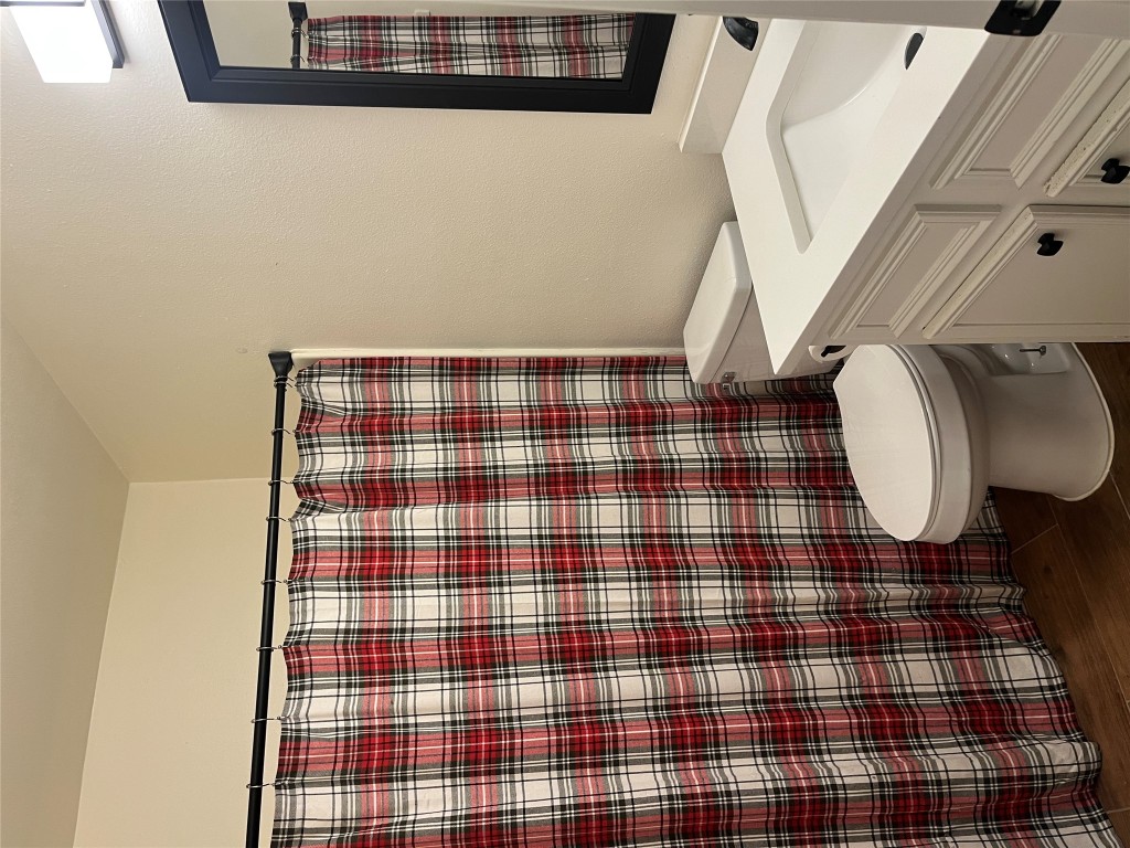 12119 Robin Ridge Lane Austin, TX 78750 - Photo 4 of 9 a bathroom with a sink toilet and shower