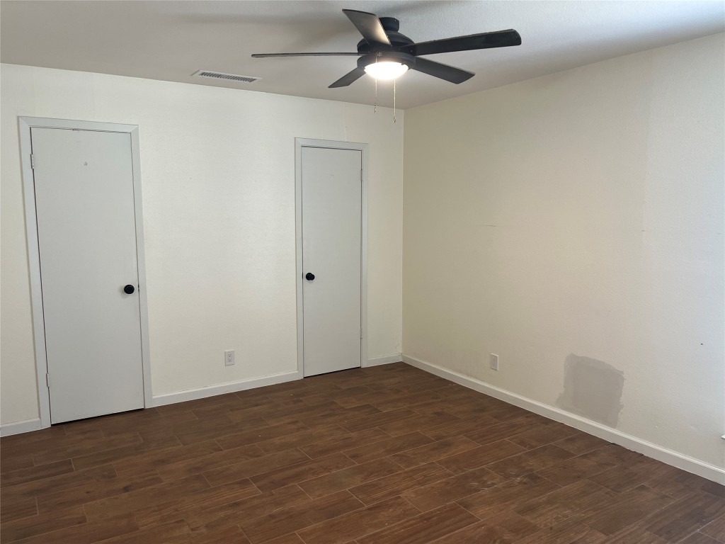 12119 Robin Ridge Lane Austin, TX 78750 - Photo 8 of 9 an empty room with wooden floor ceiling fan and window