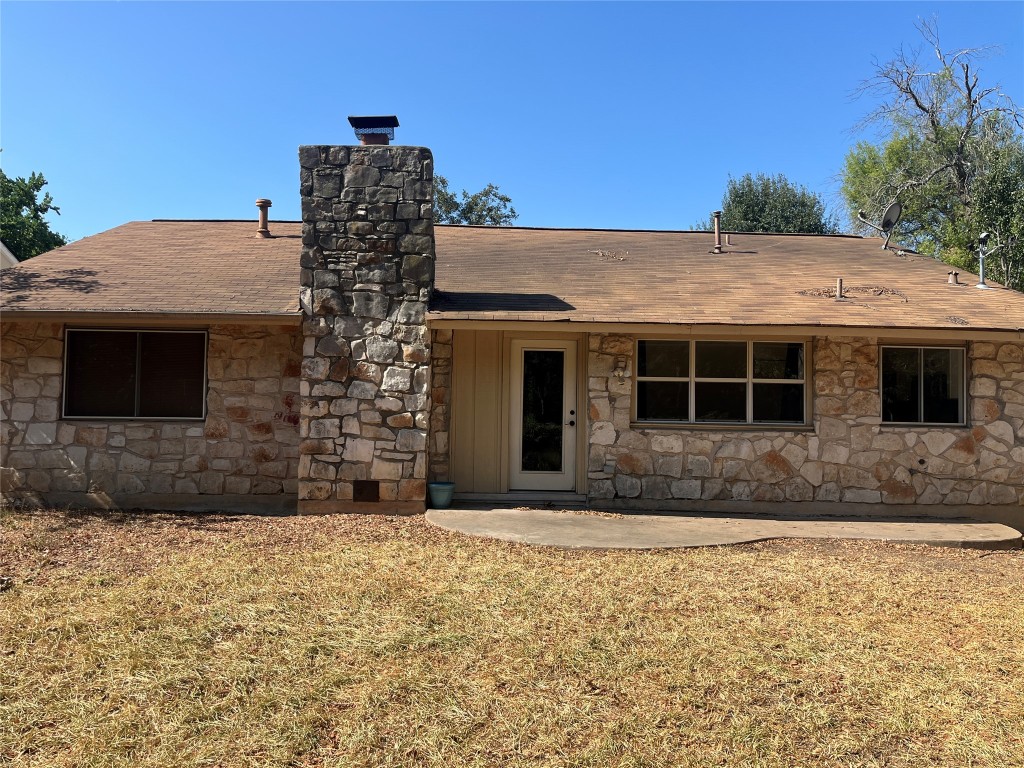 12119 Robin Ridge Lane Austin, TX 78750 - Photo 9 of 9 a front view of a house with a yard