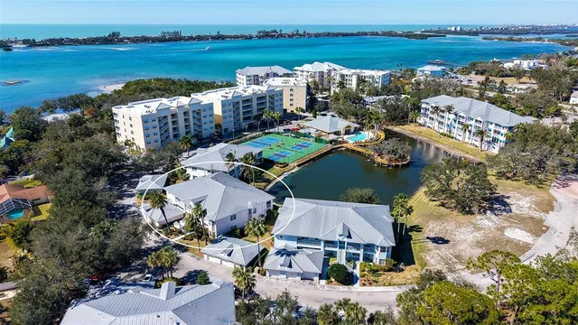 an aerial view of ocean with residential house with outdoor space and lake view