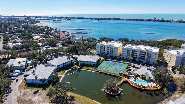 a living room with furniture and a dining table