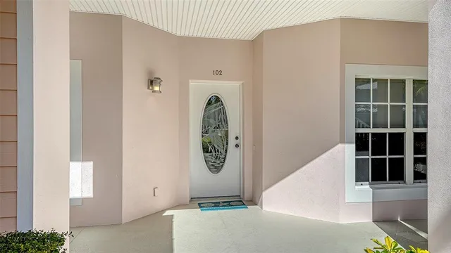 a view of a hallway with dining area a livingroom and chandelier