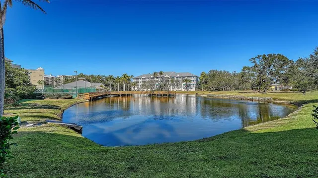 a living room with kitchen island furniture and a chandelier