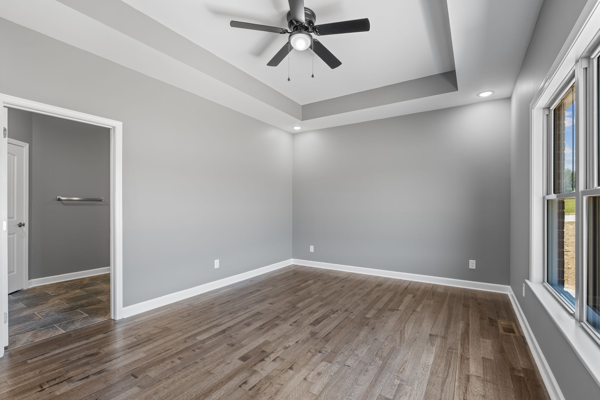 83 Watson Court Leoma, TN 38468 - Photo 8 of 18 wooden floor in an empty room with a window