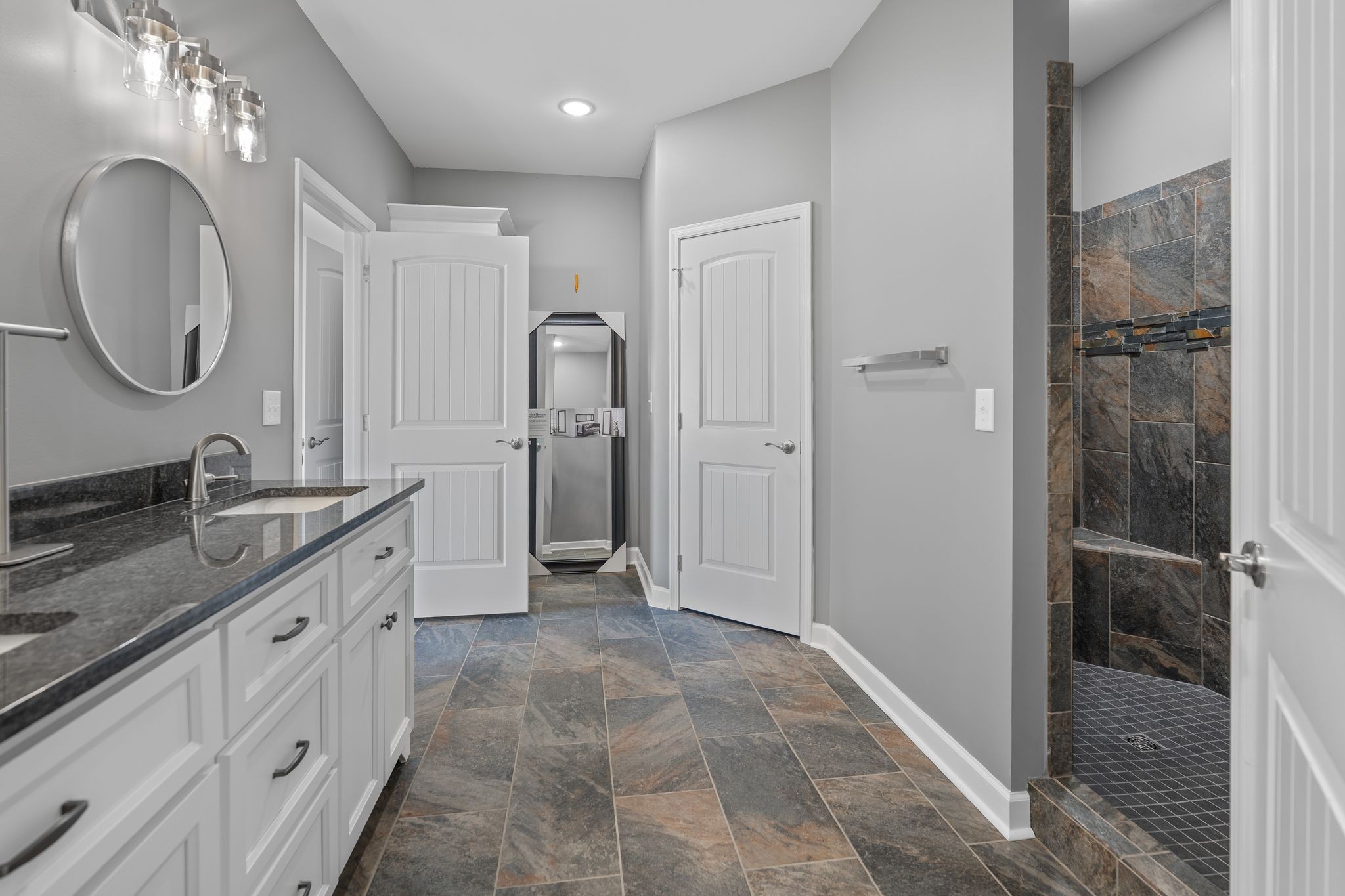 83 Watson Court Leoma, TN 38468 - Photo 10 of 18 a spacious bathroom with a double vanity sink mirror and shower