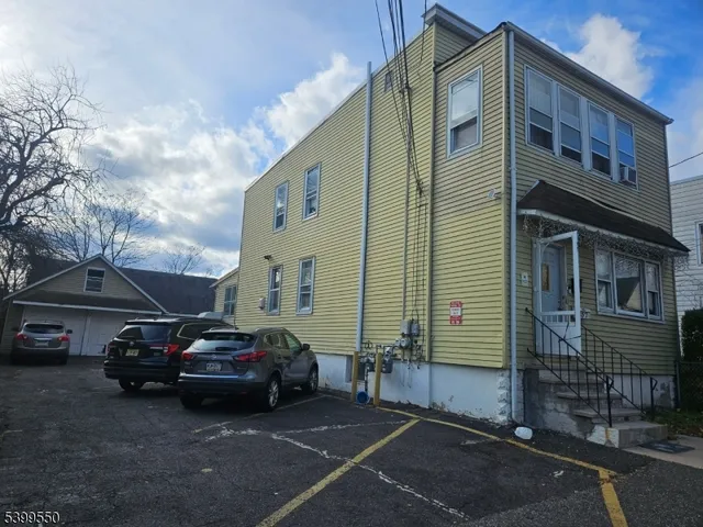 a view of a car parked in front of a building