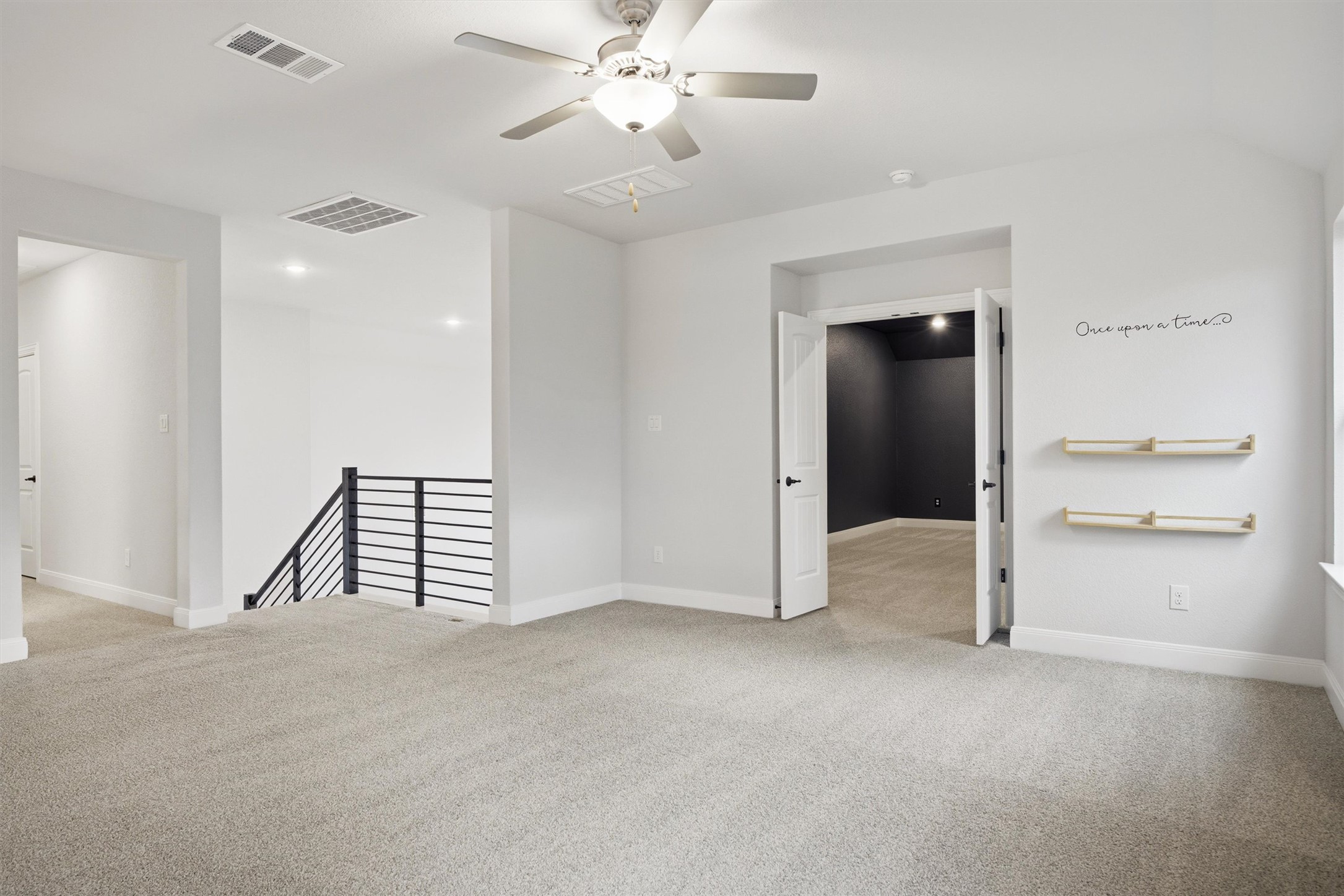 208 Tovas Secret Cove Georgetown, TX 78628 - Photo 21 of 40 an empty room with fan and hallway