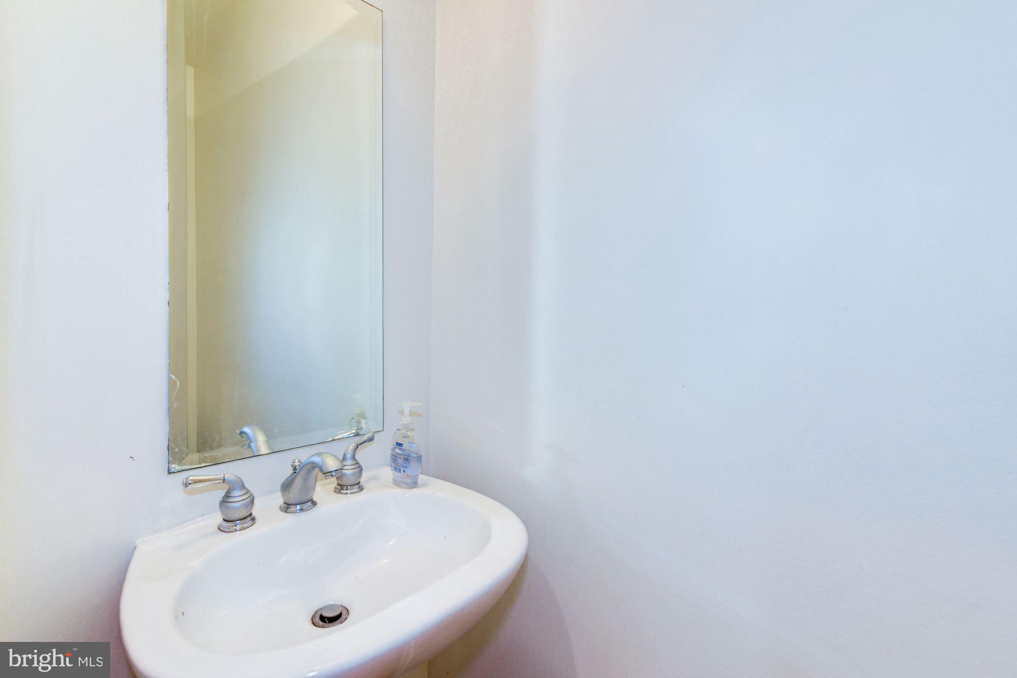 2363 Champlain Street Northwest, Unit 8 Washington, DC 20009 - Photo 14 of 30 a bathroom with a sink and a mirror