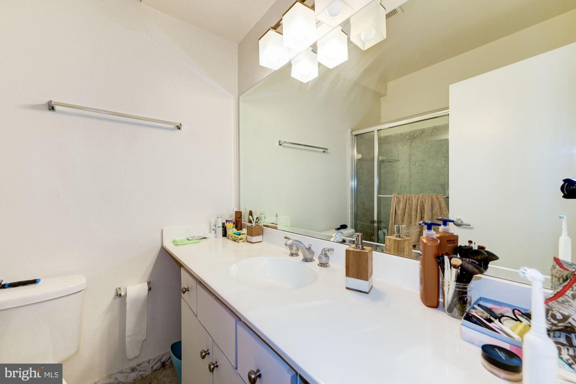 2363 Champlain Street Northwest, Unit 8 Washington, DC 20009 - Photo 27 of 30 a bathroom with a sink vanity granite and toilet