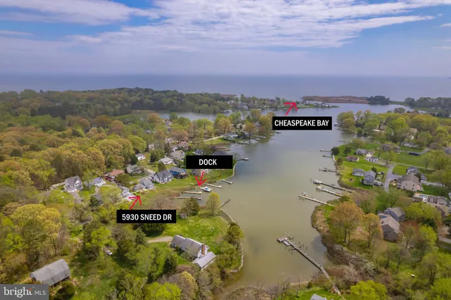 a view of residential house with outdoor space and lake view
