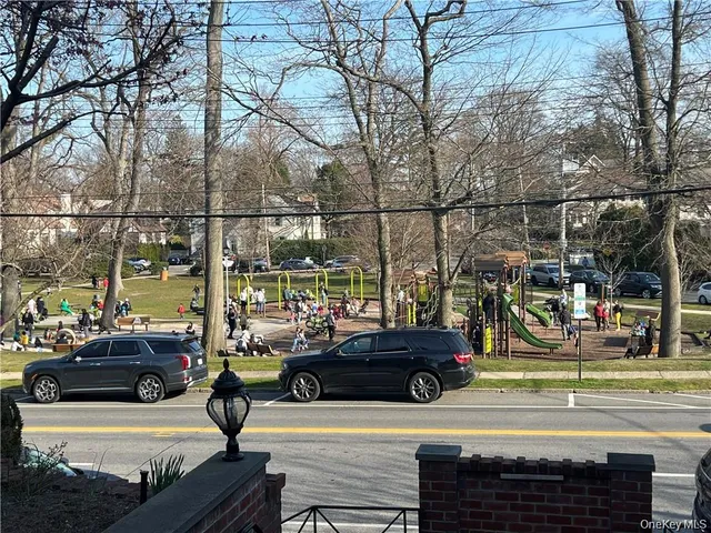 a view of a street with cars