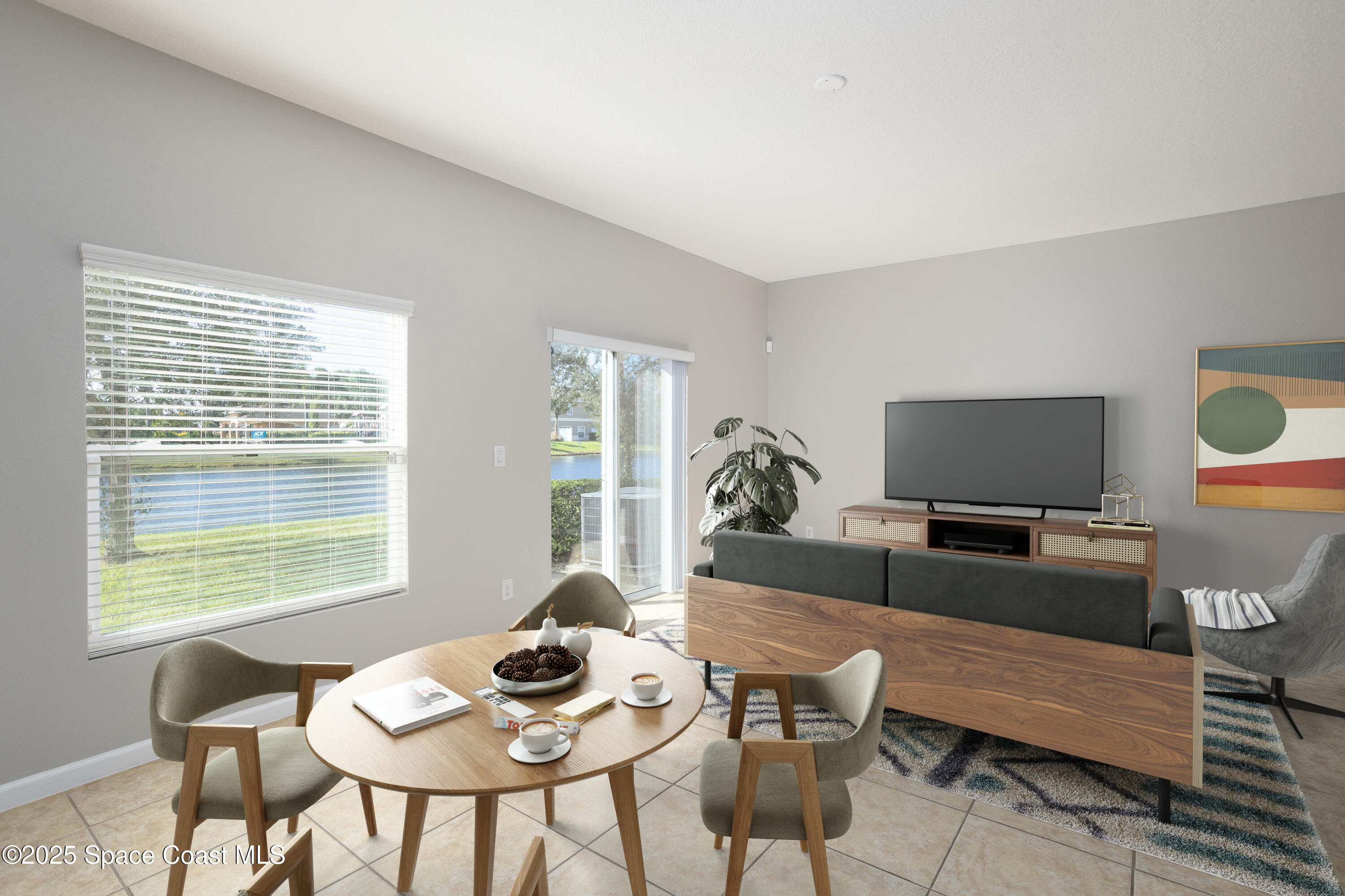 2780 Reston Street, Unit 104 Melbourne, FL 32935 - Photo 11 of 29 a living room with furniture and a flat screen tv