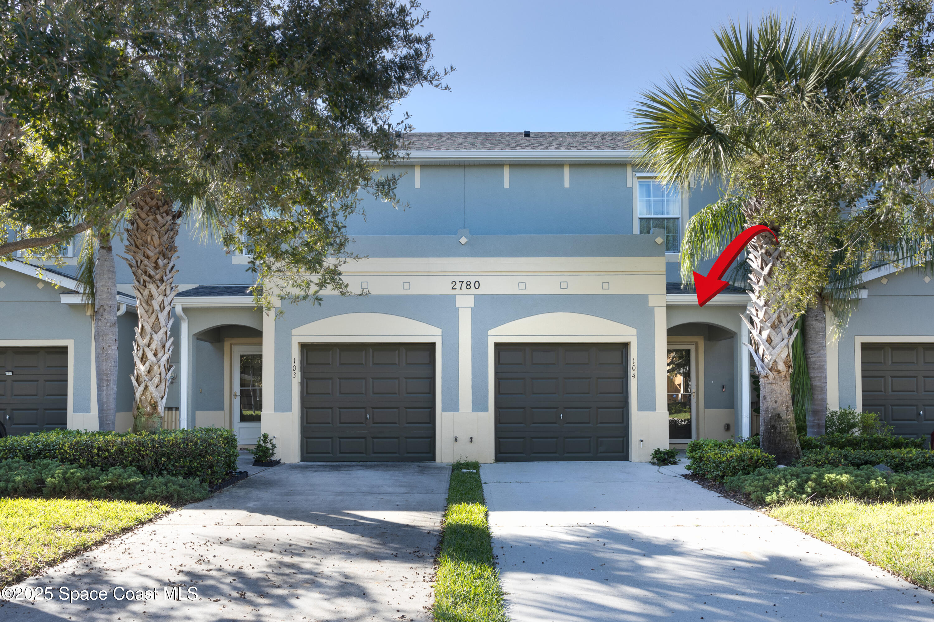 2780 Reston Street, Unit 104 Melbourne, FL 32935 - Photo 2 of 29 a front view of house with yard