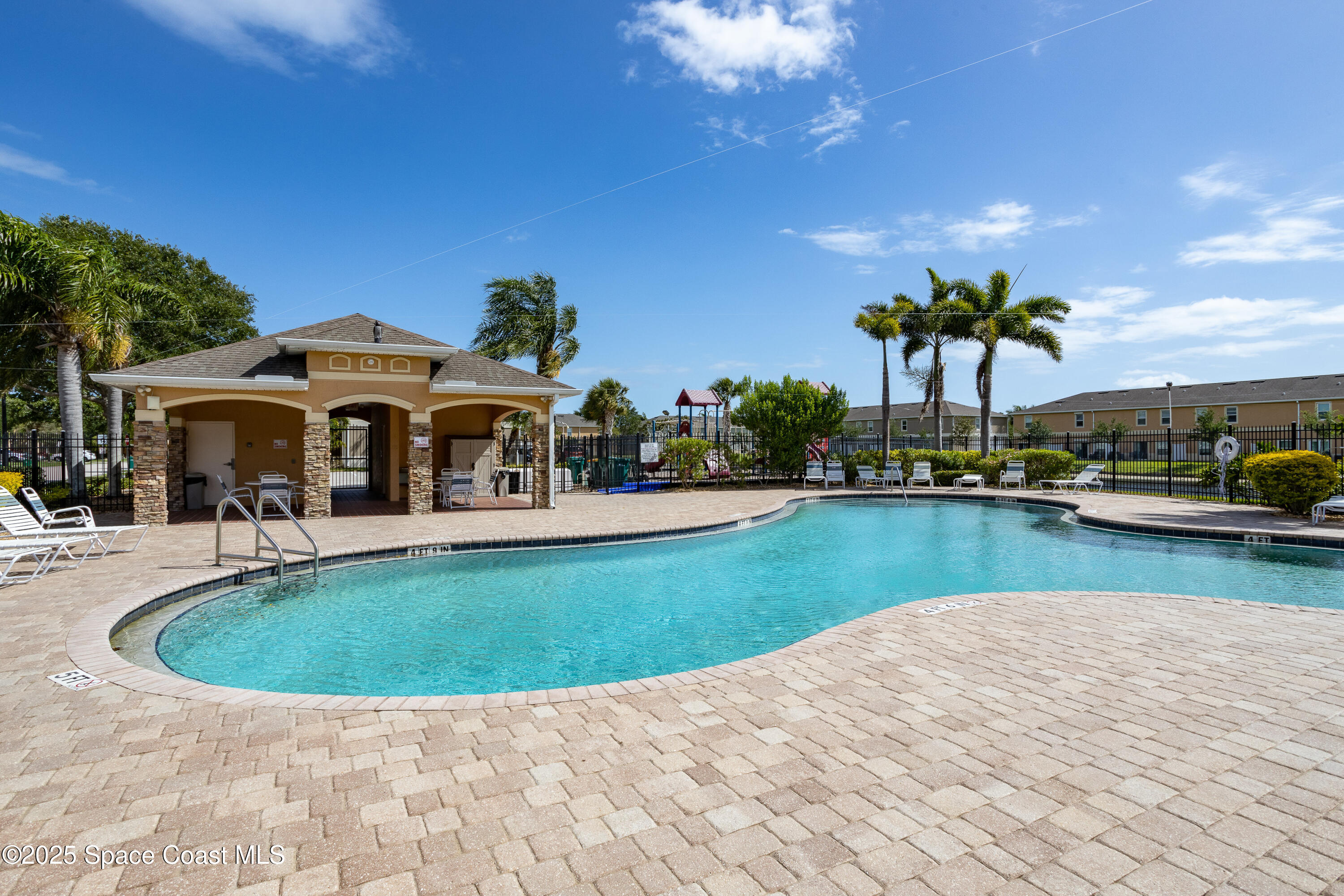 2780 Reston Street, Unit 104 Melbourne, FL 32935 - Photo 27 of 29 a view of a house with swimming pool yard and lake view