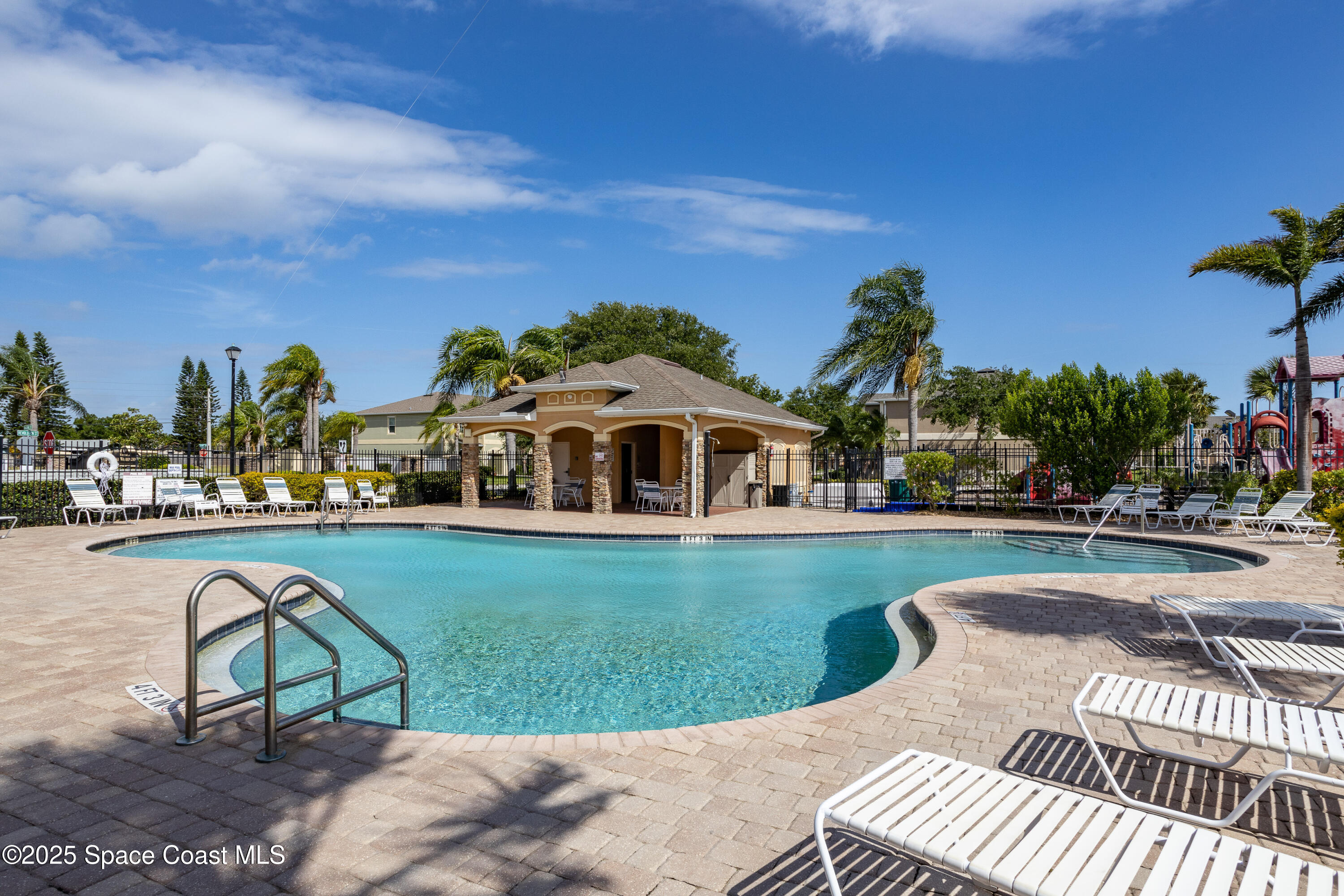 2780 Reston Street, Unit 104 Melbourne, FL 32935 - Photo 28 of 29 a view of a swimming pool and lounge chairs