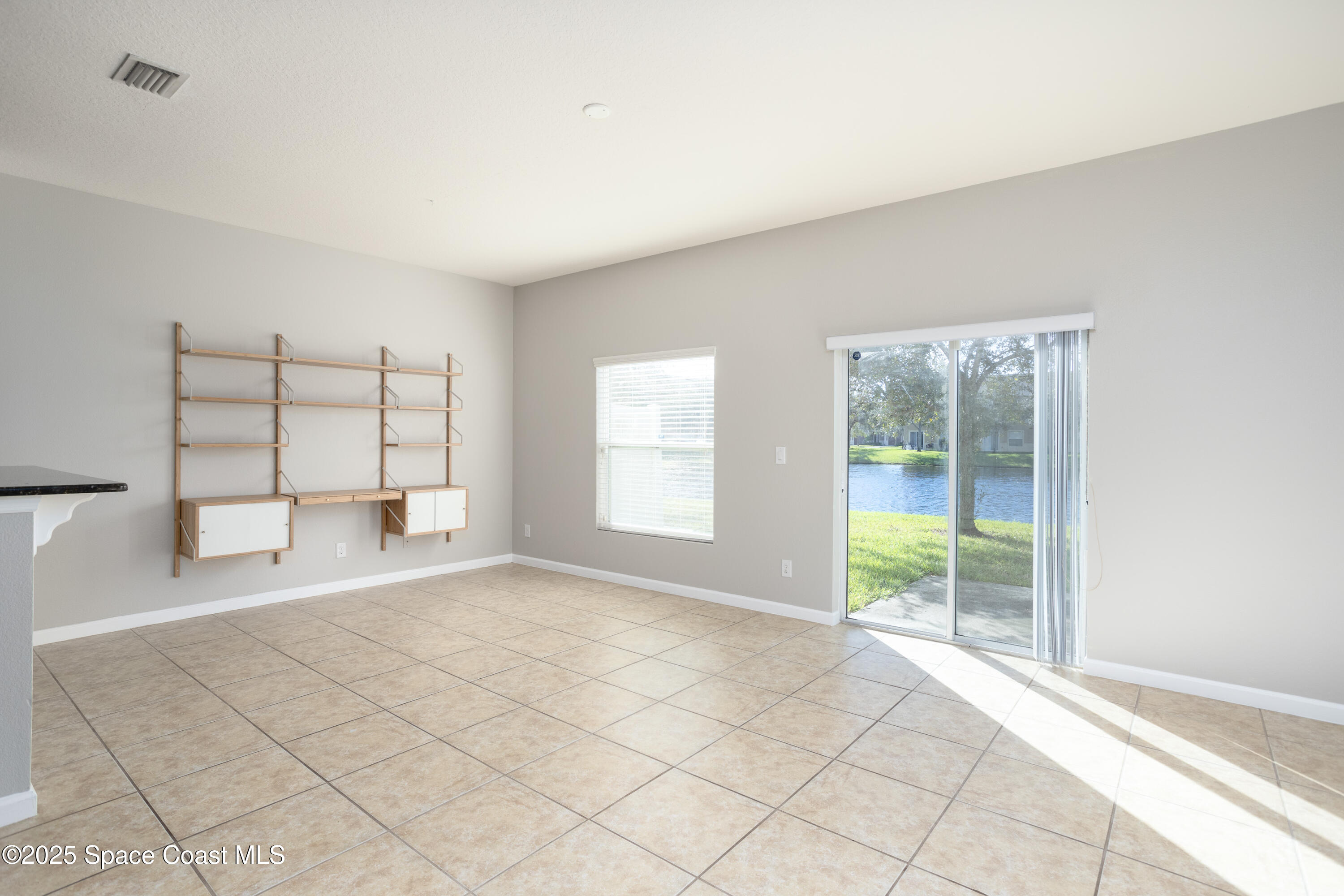 2780 Reston Street, Unit 104 Melbourne, FL 32935 - Photo 8 of 29 a view of an empty room with a window