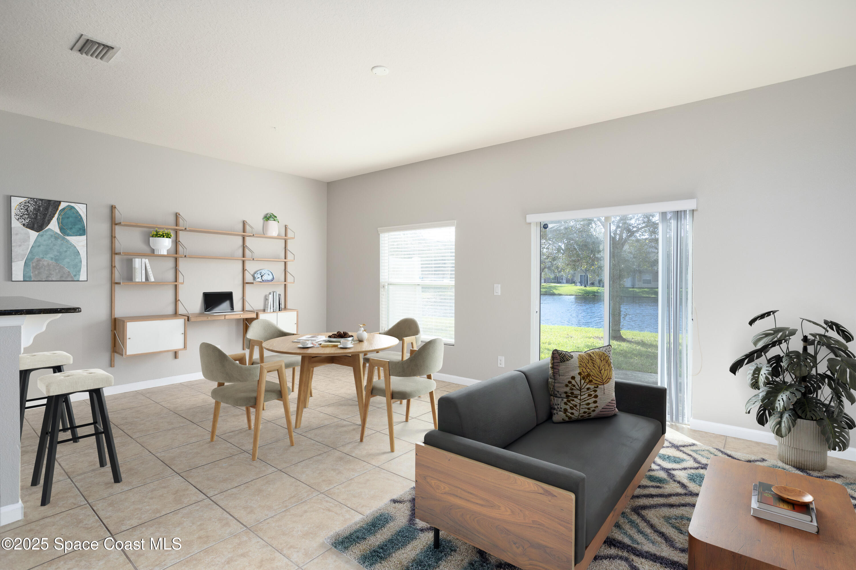 2780 Reston Street, Unit 104 Melbourne, FL 32935 - Photo 9 of 29 a living room with furniture and a large window