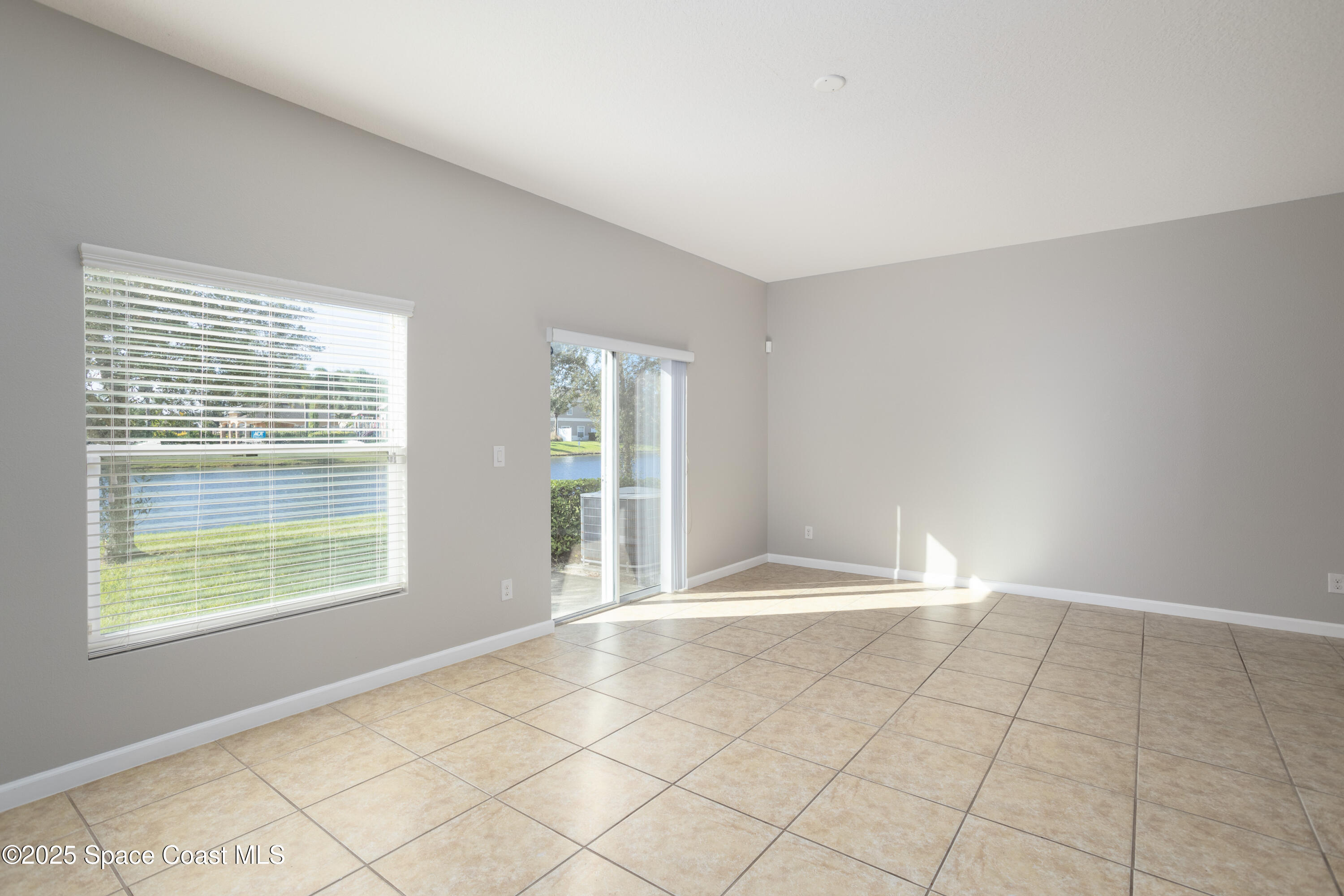 2780 Reston Street, Unit 104 Melbourne, FL 32935 - Photo 10 of 29 a view of an empty room with a window