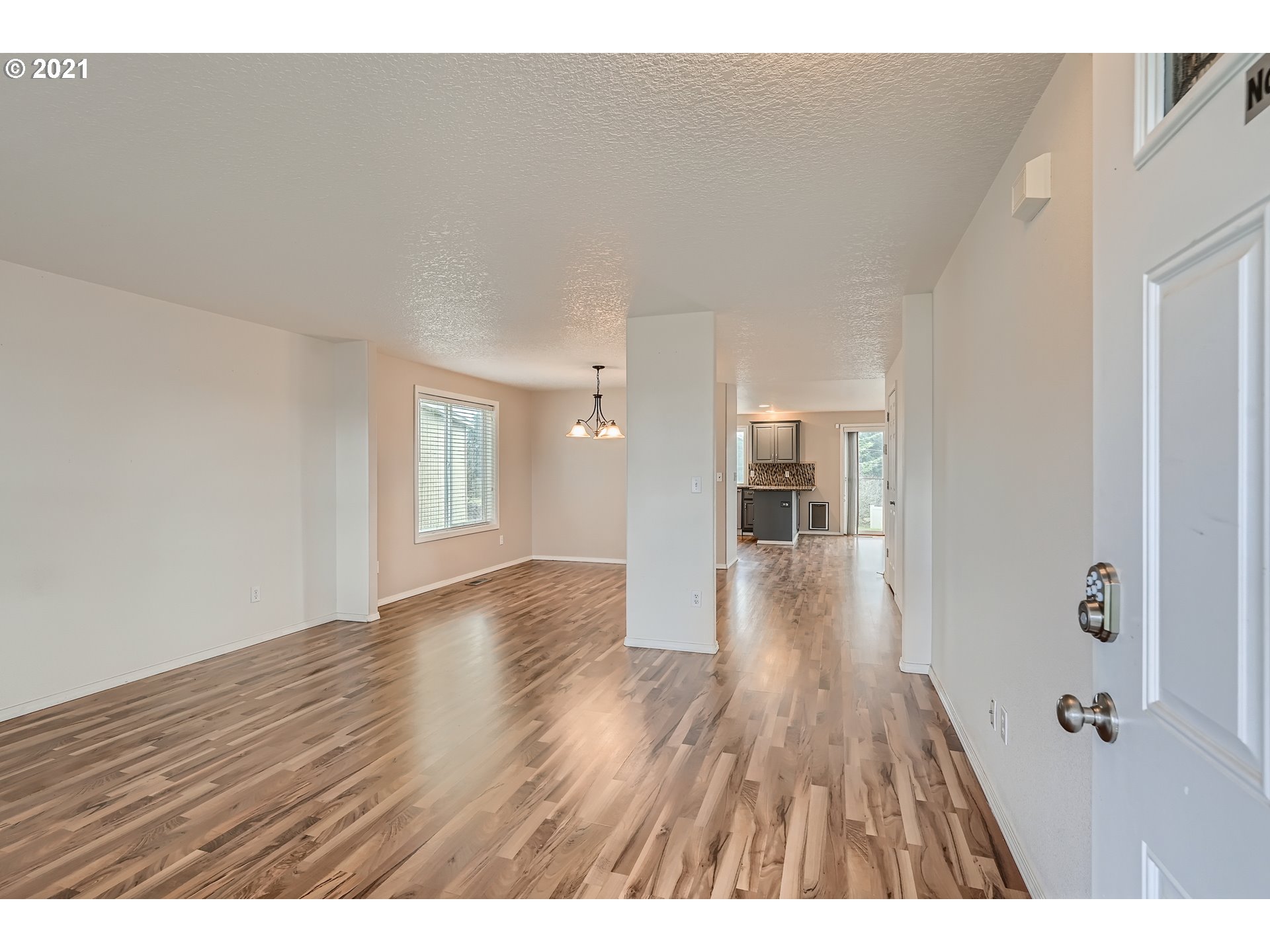 2417 North 9th Circle Ridgefield, WA 98642 - Photo 11 of 32 a view of an empty room and wooden floor