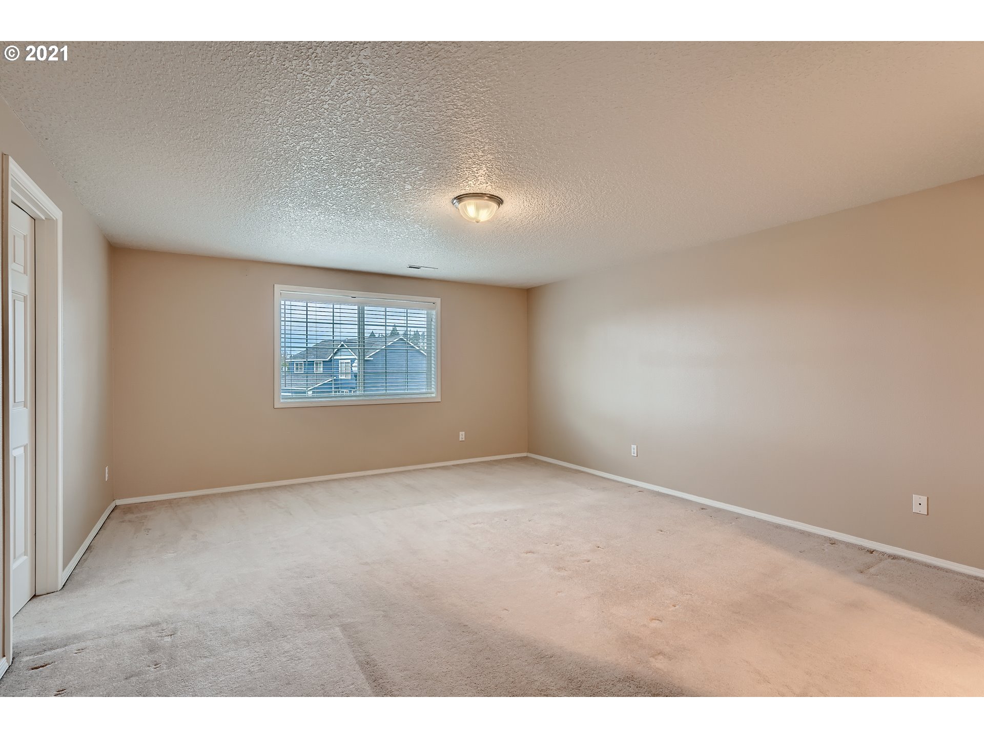 2417 North 9th Circle Ridgefield, WA 98642 - Photo 16 of 32 a view of an empty room with a window