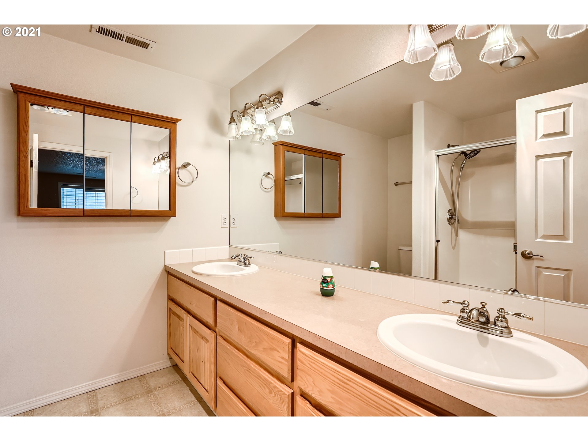 2417 North 9th Circle Ridgefield, WA 98642 - Photo 18 of 32 a bathroom with a sink and a mirror
