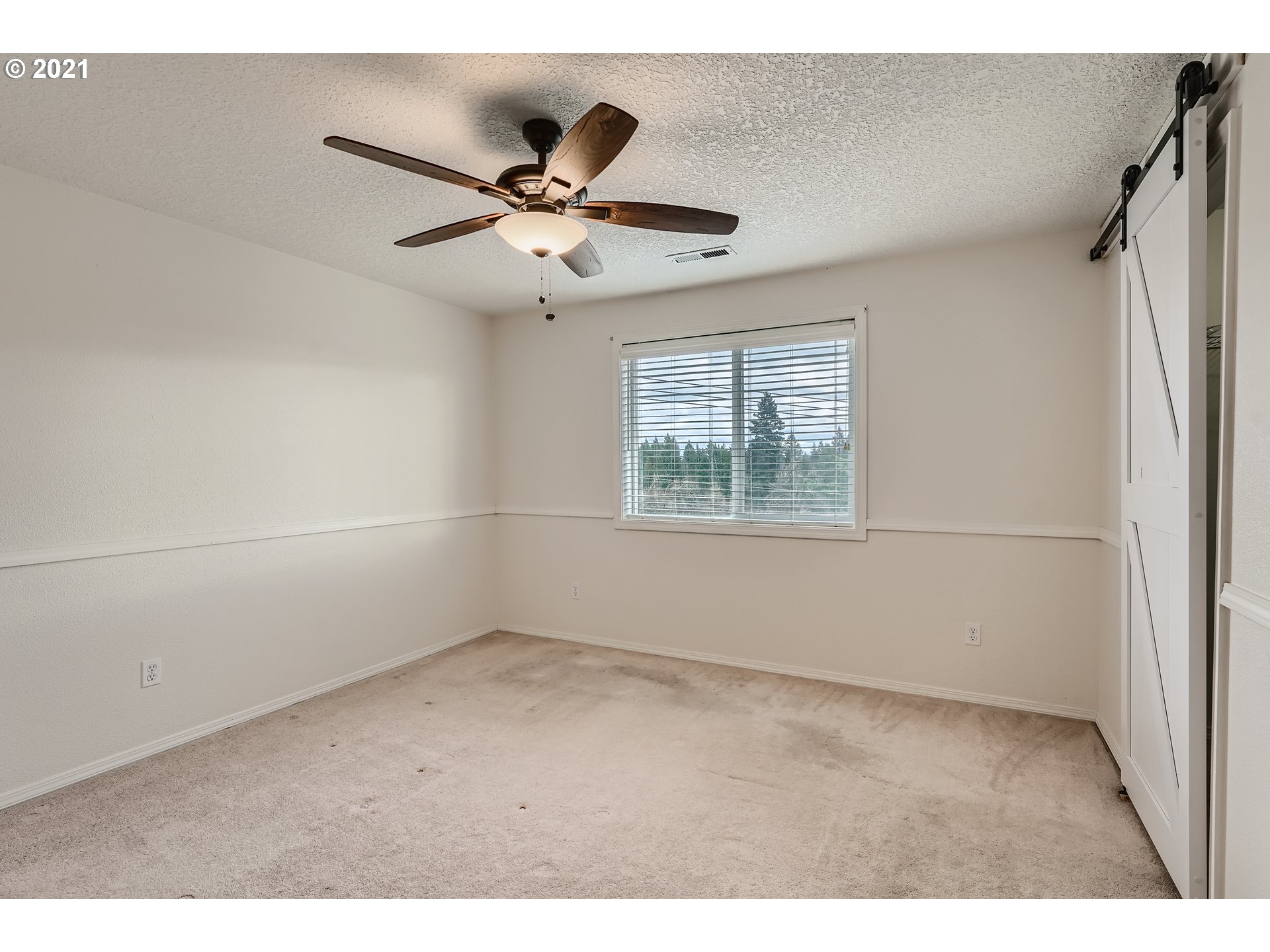 2417 North 9th Circle Ridgefield, WA 98642 - Photo 22 of 32 a view of an empty room with a window