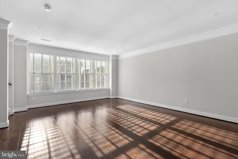 a view of kitchen with stove and wooden floor
