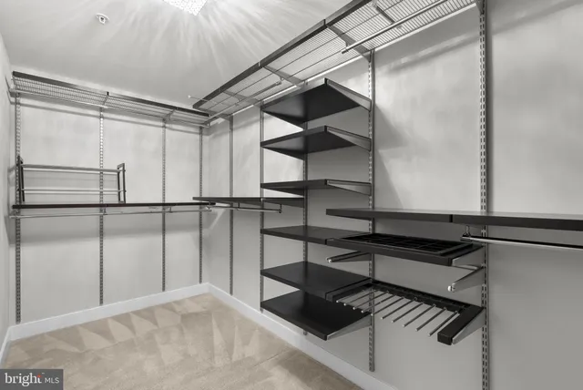 a bathroom with a granite countertop tub sink and mirror