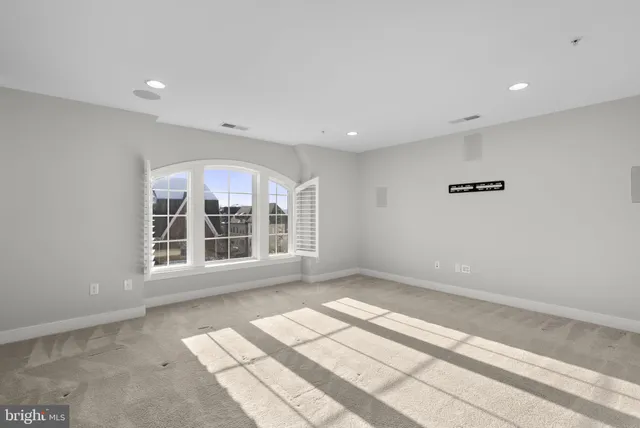a view of a big room with wooden floor and bedroom