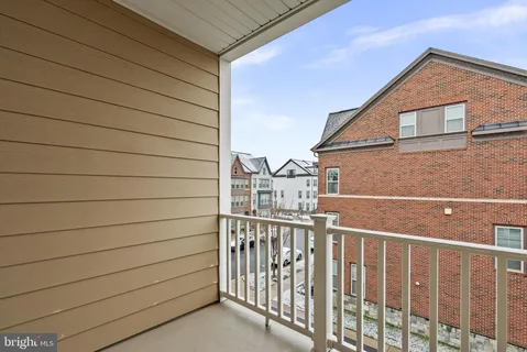 a bathroom with a granite countertop tub sink and mirror