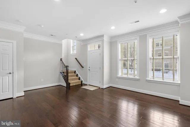 a view of a house with a small yard