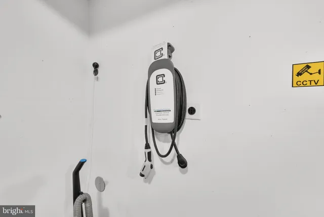 a view of a house with a door and wooden fence