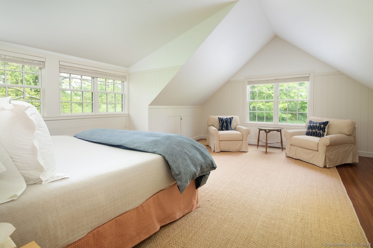 11 Valley Road Salisbury, CT 06039 - Photo 38 of 40 a spacious bedroom with a bed and a couch with window