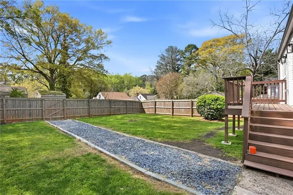 a view of a yard with a house and a park