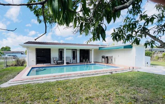 a spacious bedroom with a bed and a couch