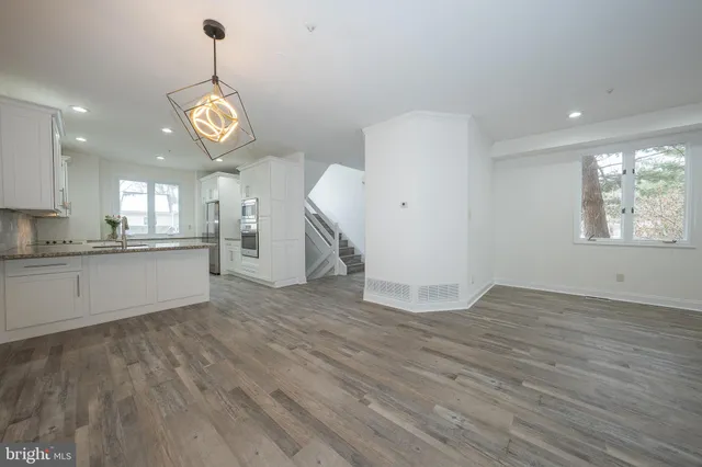 a balcony with wooden floor and fence